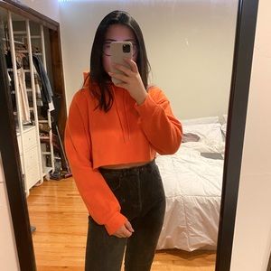cropped neon orange sweatshirt